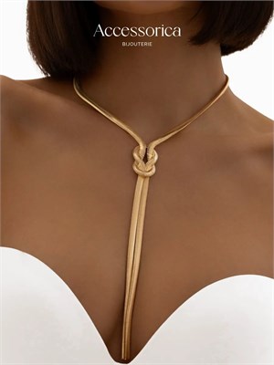 Аксессуаром к золотому галстуку является женское колье 1000023110